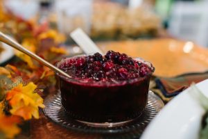 cranberry sauce on the table for thanksgiving dinner with decorated table