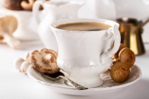 Mushroom coffee in white porcelain vintage cup