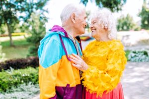 old modern couple dressing fashionable colored clothes