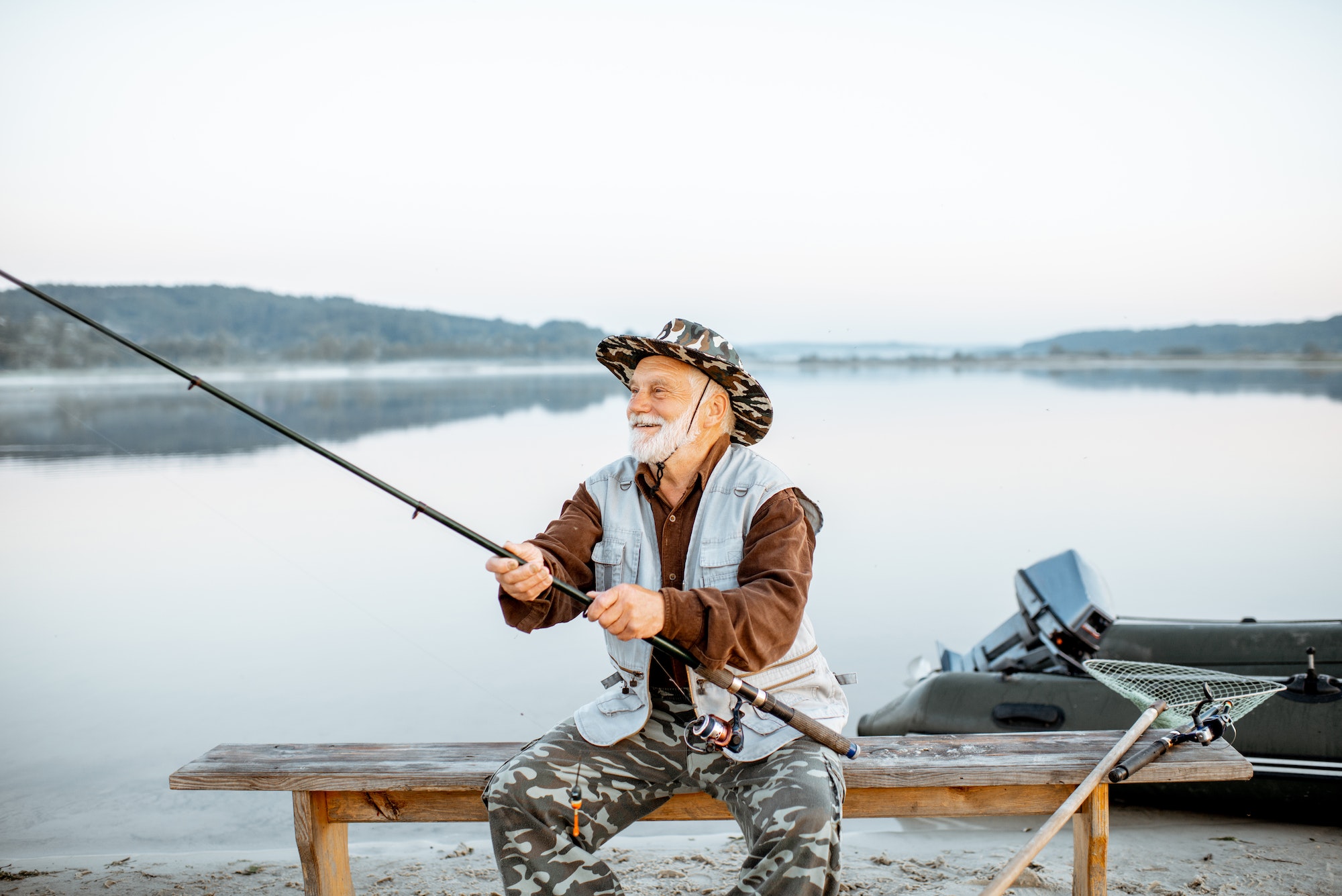 Senior man fishing on the lake