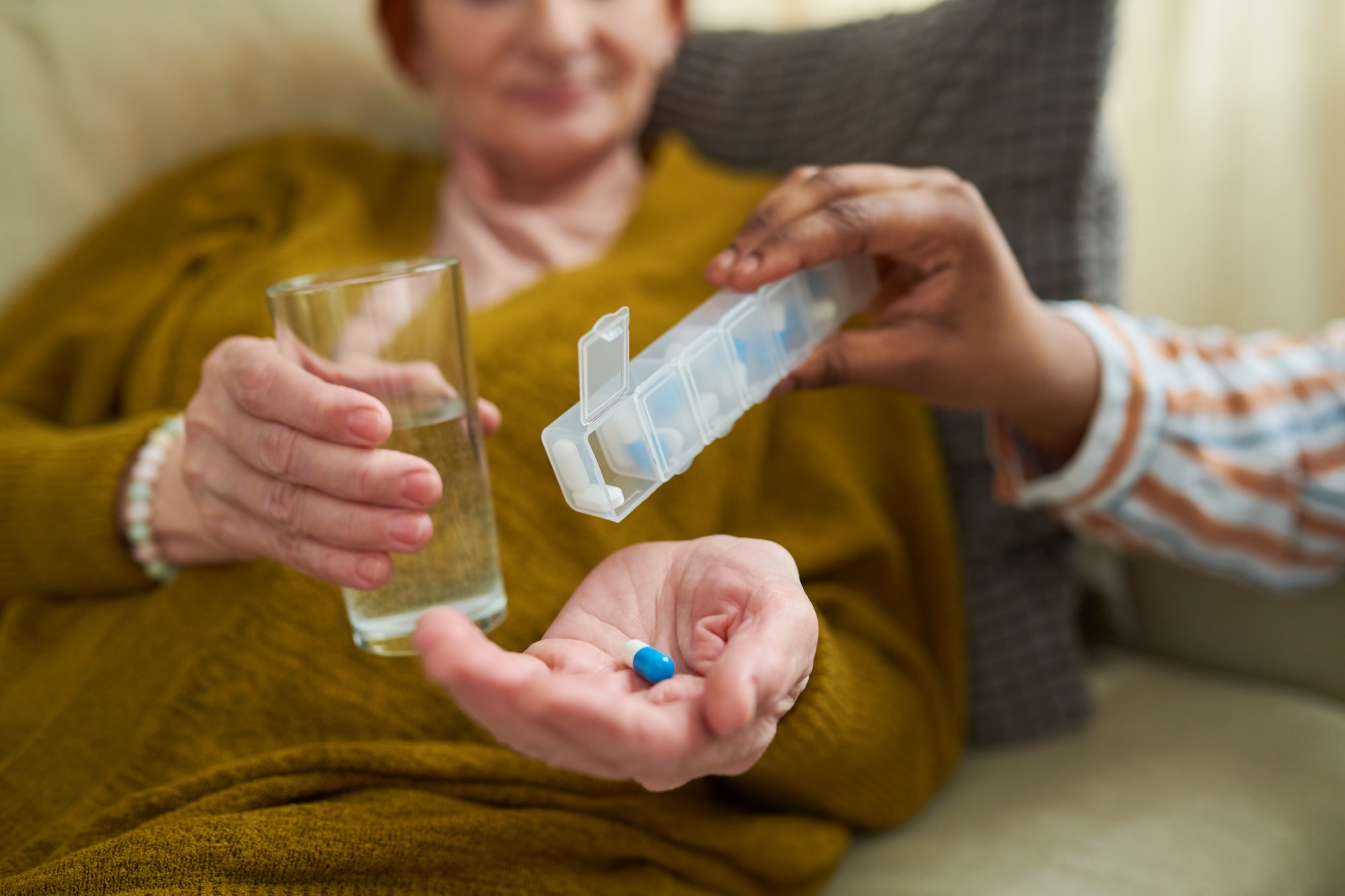 Senior woman taking prescription medications